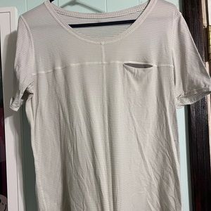 Lululemon white tshirt with front pocket. Size 6. Great condition